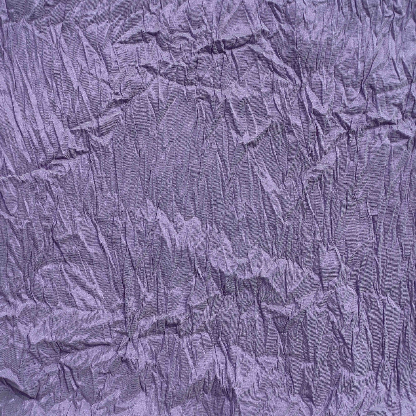 An European lightweight Polyester Crinkle in Lavender. This fabric is soft, drapes well and breathable despite its weight.