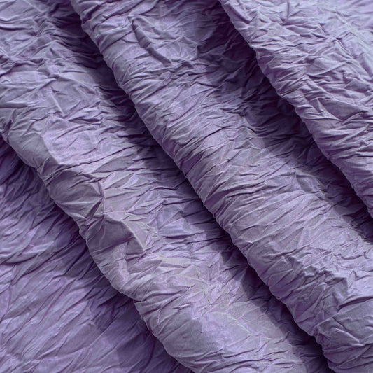 An European lightweight Polyester Crinkle in Lavender. This fabric is soft, drapes well and breathable despite its weight.
