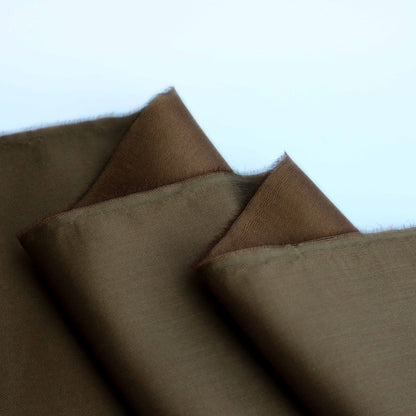 A lightweight duchess satin weave in an earthy Copper. This fabric has a dry, smooth hand feel yet softens considerably after washing. This fluid-non stretch fabric has subtle texture throughout and a matte finish.