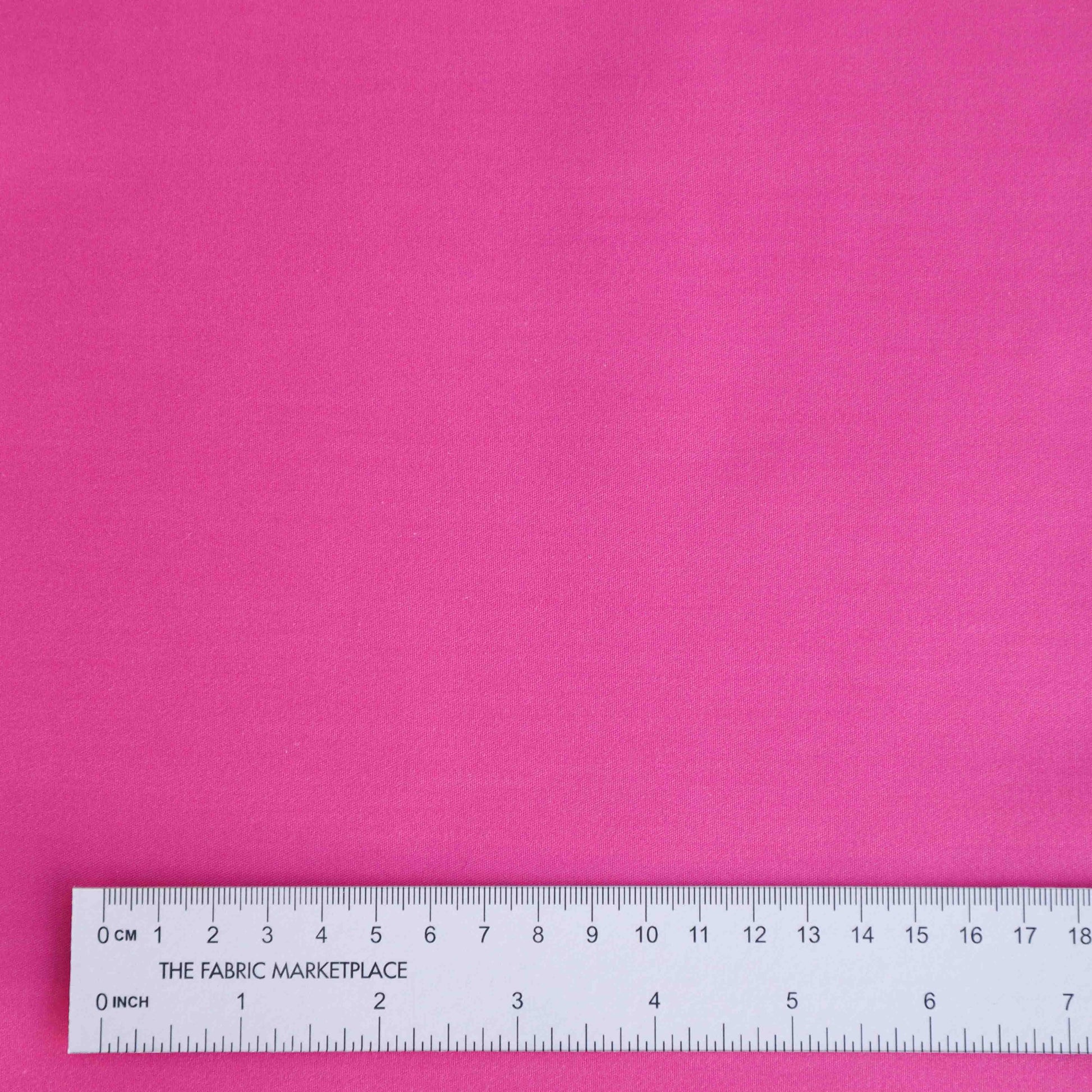 A heavyweight cotton twill in fuchsia. This fabric has a dry, smooth hand feel yet softens considerably after washing. This fluid-non stretch fabric has subtle texture throughout and matte finish.