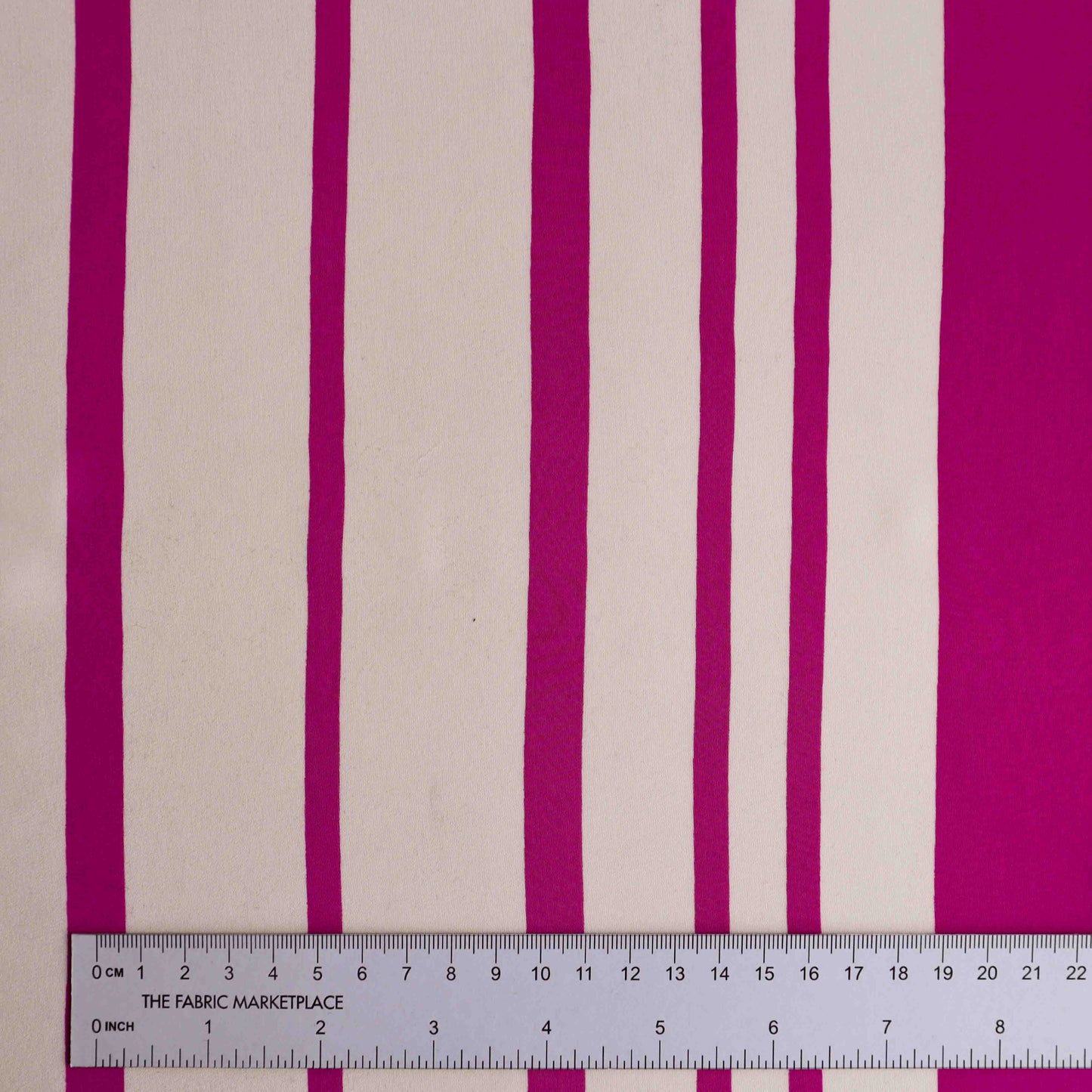 An European-made lightweight crepe-de-chine in white with magenta stripe patterns. This fabric has a dry, smooth hand feel yet softens considerably after washing.