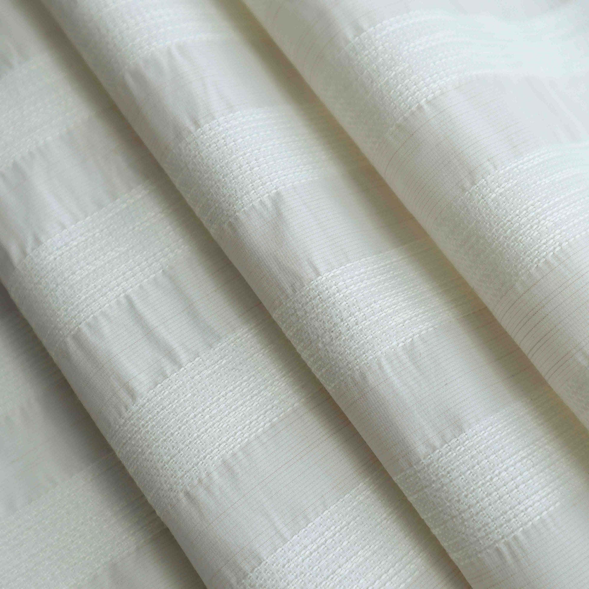A Japanese-made lightweight poly cotton in off stitch. This fabric is designed with neatly arranged white stripes. This fabric is soft, comfortable with its no-stretch properties.