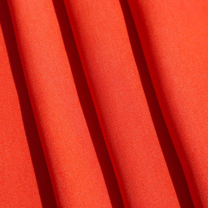 A Mid-weight twill weave in Crimson. This fabric has a dry, smooth hand feel yet softens considerably after washing. This fluid-non stretch fabric has subtle texture throughout and matte finish.