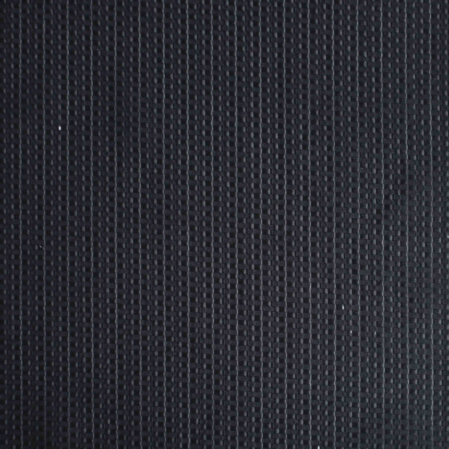 An European-made lightweight polyester silk in Black Caviar. Composing of neatly arranged black small squares, this almost opaque fabric is extremely comfortable and breathable. This fabric has a dry, smooth hand feel yet softens considerably after washing.