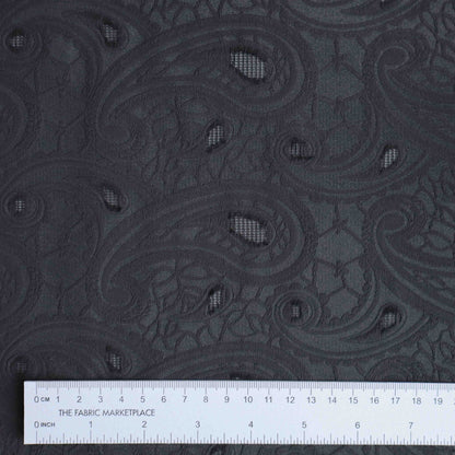 An European-made lightweight jacquard in Black Batik. Featuring black paisley prints, It has an incredible drape, a smooth, cool hand feel and with subtle stretch.