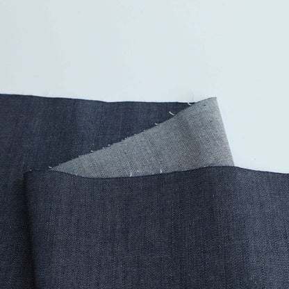 A mid-weight cotton stretch denim fabric. It does not snag or tear easily while still having a stretch to it.