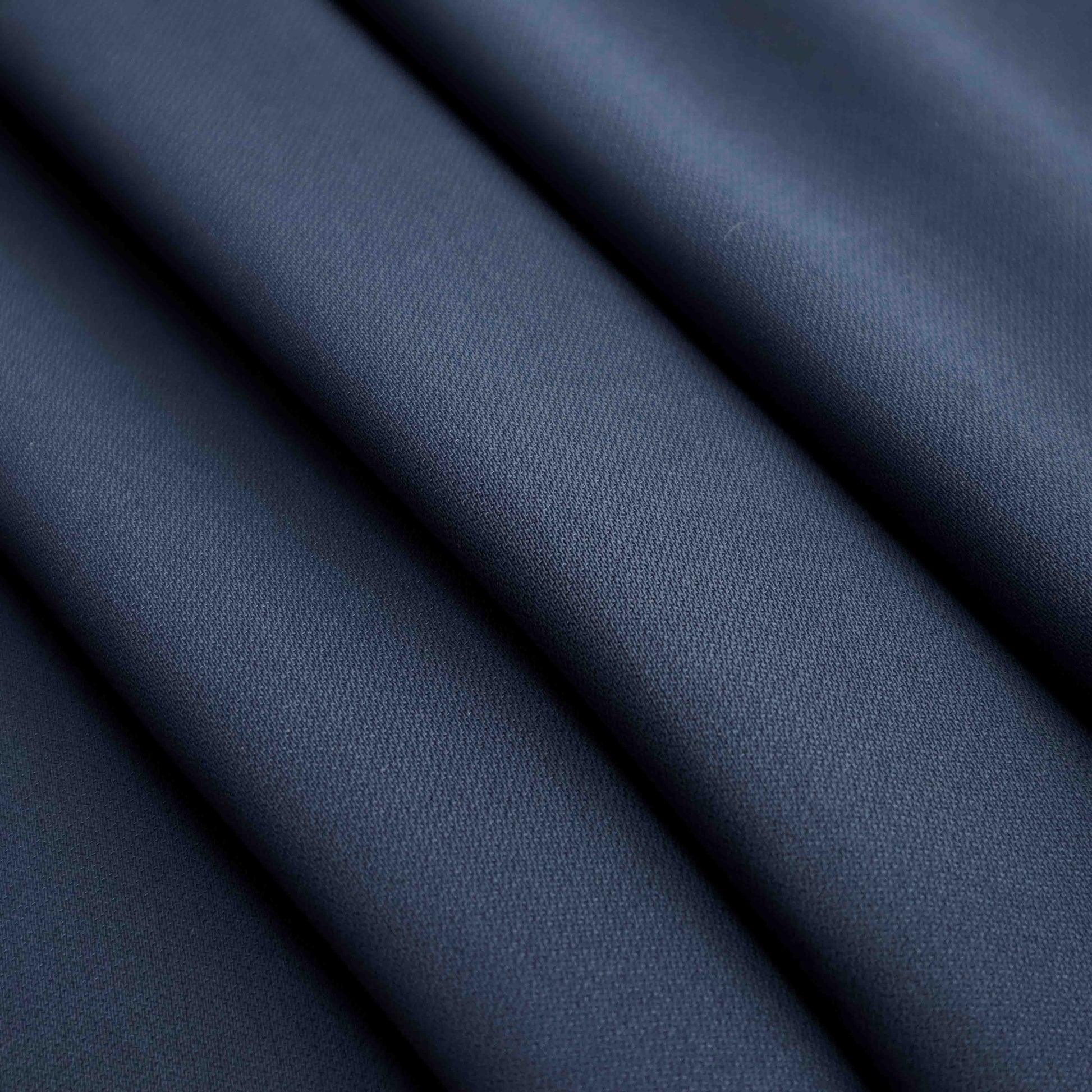 A mid-weight polyester fabric in Deep Cove. This fabric is durable and does not stretch or pill easily like cotton and other natural fibers. It is also wrinkle-resistant and will better hold its shape, drape and rigidity.